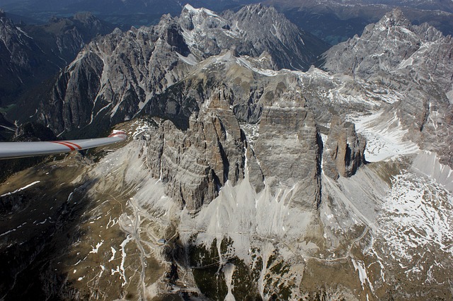 three peaks, gliding, flyby, glider pilot, from the air, nature, aerial view, from above, solid, high, mountains, lime rock, alps, trail, path, drei zinnen hut, rubble, rubble field, hiking trail, sexten dolomites, belluno, south-tirol, three peaks of lavaredo hut, rock, north walls, big pinnacle, western zinne, small gargoyle, distinctive, rock towers, summit points, punta di frida, preuß tower, smallest pinnacle, dolomites, eastern alps, veneto, italy, main dolomite, limestone