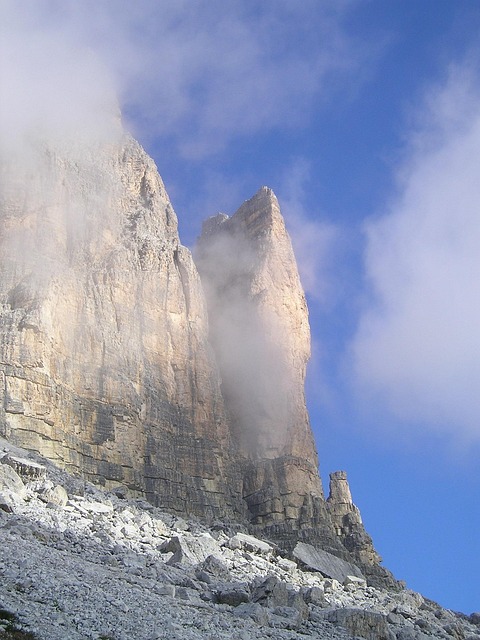 three peaks, lavaredo, small gargoyle, yellow edge, rock face, steep wall, climbing wall, rock, dolomite, dolomites, mountains, alps, south-tirol, nature, italy, rubble field, haze, cloudy